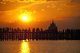 Burma / Myanmar: People gather to watch the sunset on the U Bein Bridge, the longest teakwood bridge in the world, Taungthaman Lake, near Amarapura, Mandalay